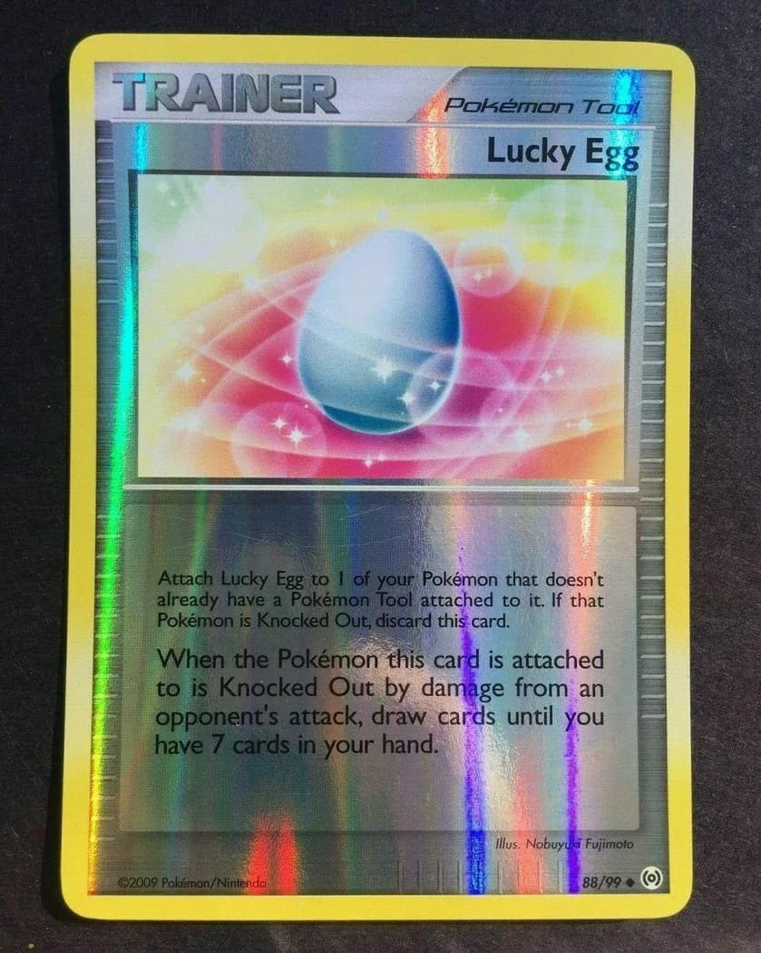 Lucky Egg reverse holo card front, Arceus 88/99