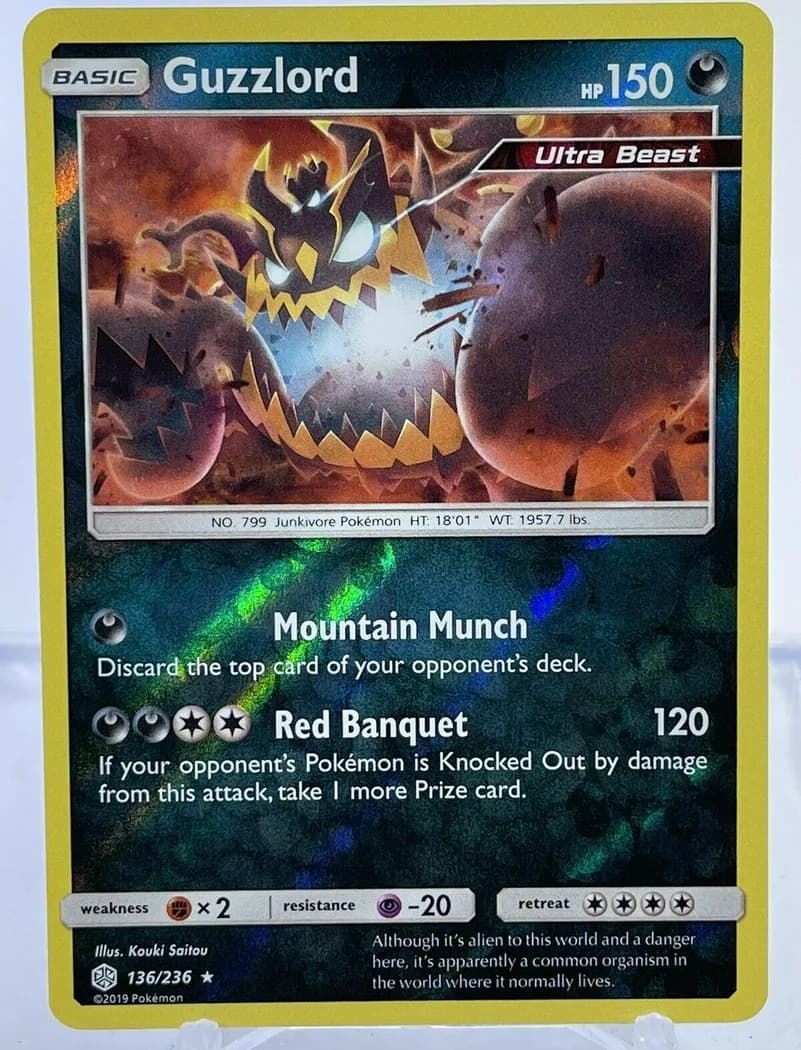 Guzzlord reverse holo card front, Cosmic Eclipse 136/236