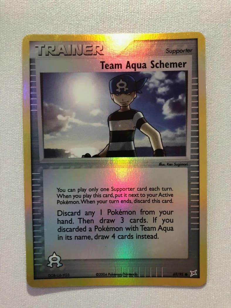 Team Aqua Schemer reverse holo card front, EX Team Magma vs Team Aqua 69/95
