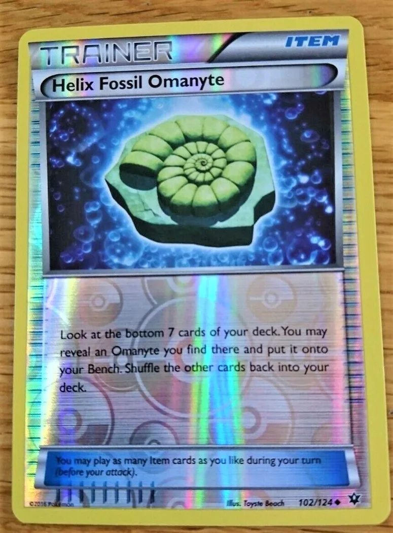 Helix Fossil Omanyte reverse holo card front, Fates Collide 102/124