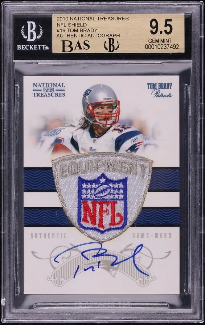 2010 Panini National Treasures Tom Brady NFL Shield Patch Autograph #19 (NFL Shield 1/1) slab front